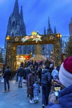 Christmas market at Roncalli Platz am Dom, in the city centre of Cologne, Sunday shopping in