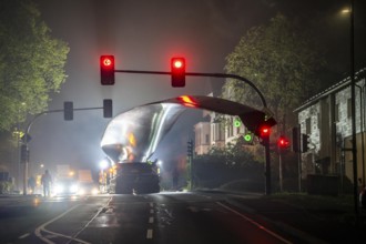 Transport of a 68 metre long, 22 tonne blade of a wind turbine, here in Breckerfeld, with a