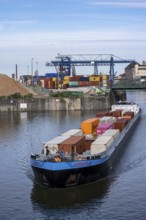 Container freighter Aarburg, leaving the container terminal in Frankfurt Osthafen, belonging to