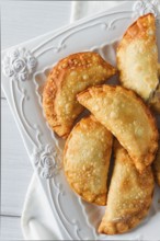 Fried chebureks, close-up, on a light background, no people