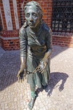 Grete-Minde monument in front of the historic town hall in the old town centre of Tangermünde. The