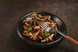 Pickled honey mushrooms, in a bowl, homemade, top view, no people