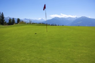 Crans Sur Sierre Golf Course with Hole 7 and Mountain View in Crans Montana in Valais, Switzerland,