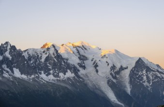 Morning atmosphere, mountain landscape at sunrise, glaciated mountain peak of Mont Blanc in the