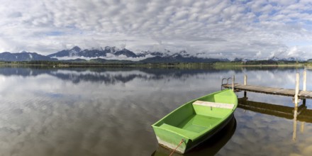 Rowing boat at sunrise, Hopfensee, Hopfen am See, near Füssen, Ostallgäu, Allgäu, Bavaria, Germany,