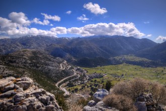 Mountainous landscape with serpentines, meadows and settlements, partially shaded, Askifou plateau,