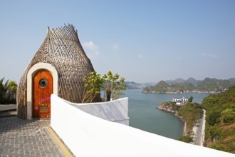 Spa cottage at the Hotel Perle d'Orient, with Cat Ba Island and the karst rocks of Lan Ha Bay in