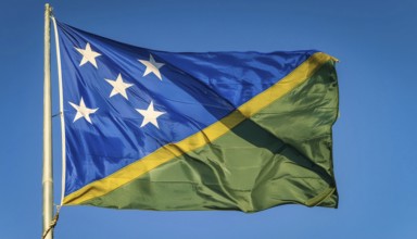 The flag of Solomon Islands, Solomon Islands, island nation in the South Seas, flutters in the