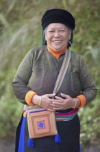 Vietnamese woman, 69 years old, from the Hmong minority in everyday clothes, portrait, Bac Sum