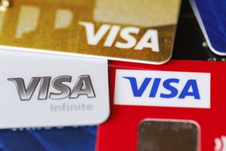 Credit cards from VISA to pay as background in Stuttgart, Germany, Europe