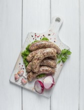 Raw kupaty, traditional Georgian sausages, raw sausages, with spices and herbs, Georgian cuisine