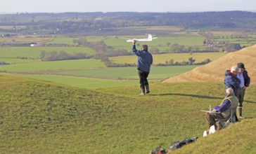 Flying model airplanes from Roundway Down, North Wessex Downs, Wiltshire, England, UK