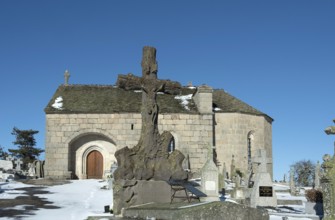 Cemetery and chapel of Saint-Pierre-le-Vieux in winter. Lozere department. Occitanie. France