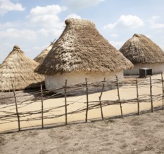 Buildings of replica Neolithic huts at the Stonehenge site, Wiltshire, England, UK