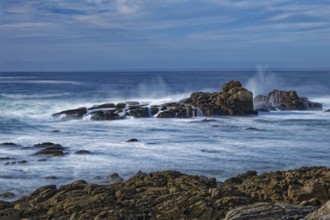 The waves of the Atlantic wash over the rocks on the coast off Penmarch in Brittany. Finistere,