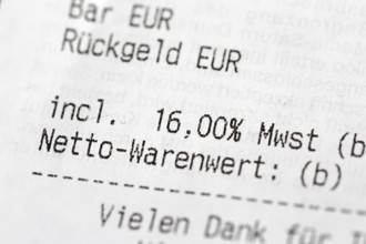 Close-up of a till receipt showing the reduction in VAT to sixteen per cent in Germany due to the