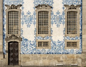 The facade of Igreja do Carmo church, adorned with intricate blue and white tiles, Porto, Portugal,