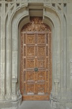 Portal with wooden door and wood carving, Minster of Our Lady, church door, arts and crafts,