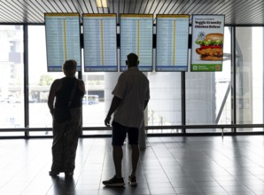 Info screens for departures, arrivals at Amsterdam Schiphol Airport, Terminal, Netherlands