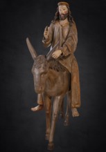 Palm tree donkey, wooden figure from 1470, on a dark background, Franciscan Museum, Villingen,