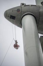 Height rescuers from the Oberhausen professional fire brigade practise abseiling from a wind