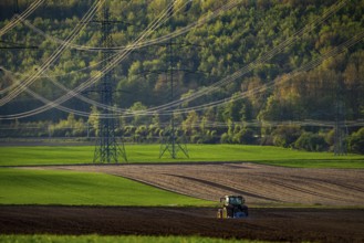 Tractor working a field near Grevenbroich, in spring, Germany, Europe