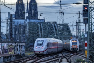 ICE train on the track in front of Cologne Central Station, Hohenzollern Bridge, Cologne Cathedral,