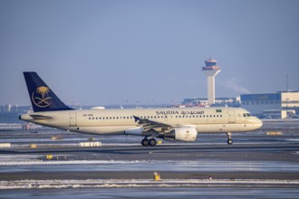 Saudia Airbus A320-200 on the way to Runway West, Frankfurt Airport FRA, Fraport, in winter, Hesse,