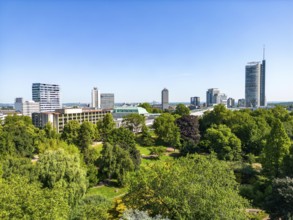 The skyline of Essen city centre, with the RWE Tower on the right and Stadtgarten Park in front,