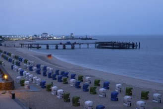 View from above towards the harbour, beach with beach chairs, blue hour, Wyk, Föhr, North Sea