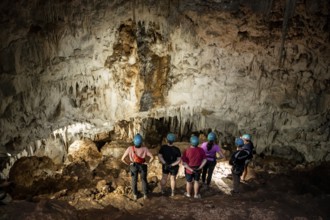 Visitors in a stalactite cave, tourists looking at stalactites in the Terciopelo Cave, Barra Honda