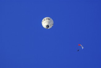 Landesbank BW hot air balloon and parachutist with open parachute in the air, as part of the