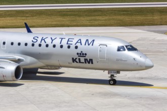 A KLM cityhopper Embraer 190 aircraft with the registration PH-EZX and the Skyteam special livery