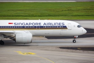 A Singapore Airlines Airbus A350-900 aircraft with the registration 9V-SHN at Changi Airport,