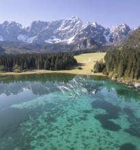 Aerial view of Lake Fusine and the Mangart mountain range, Tarvisio, province of Udine, Italy,