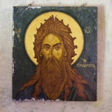 Orthodox icon of a saint with halo on ancient wall painting, Chapel of Agios Ioannis Prodromos,