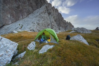 Wild camping, camping in the wilderness with a tent, Kol Suu mountain lake, Sary Beles Mountains,