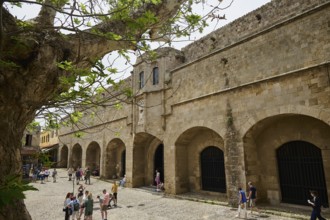 Building of the Archaeological Museum, people walking in front of a large historical building on a