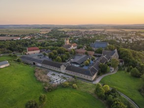 A village with several buildings and fields in the evening, Allstedt, Harz, Germany, Europe