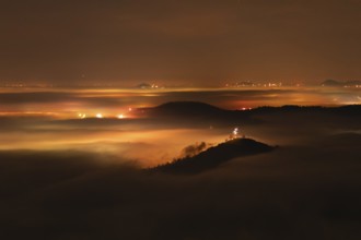 New Year's Eve fireworks 2024 on the Breitenstein, Swabian Alb near Ochsenwang. Sea of fog in the