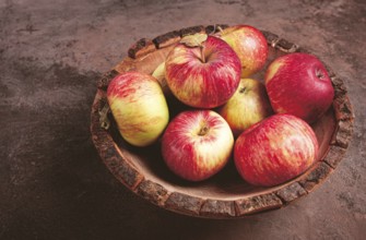 Apples in a wooden bowl, top view, yellow - red, summer variety, early, no people