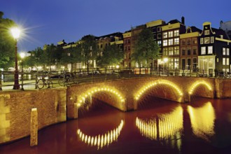 Seven bridges illuminated with neon lights at the corner of Keizersgracht and Reguliersgracht,