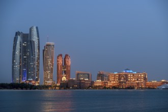 Skyline at dusk, Etihad Towers and Emirates Palace Hotel, Abu Dhabi, Emirate of Abu Dhabi, United