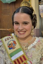 Girl from the Falla group "La Font" wearing traditional dress at the Las Fallas Spring Festival,