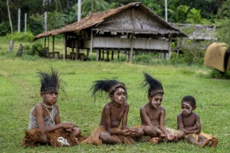 Children with headdress made of cassowary feathers, village Mutin, Lake Murray, Western Province,