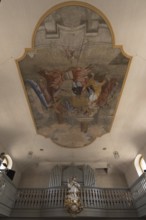 Ceiling painting and the figure of St. Nepomuk in front of the organ loft in the parish church of