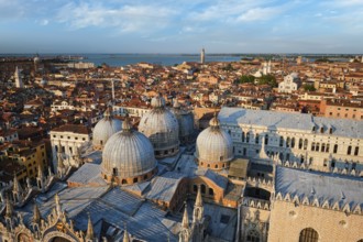 View of Venice with famous St Mark's Basilica and Doge's Palace on sunset from St Mark's Campanile