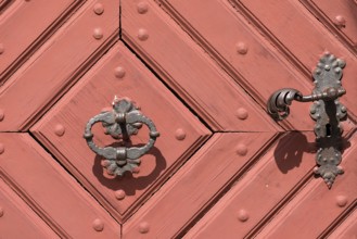 Historic door handle and knocker on the front door of the former provost's court of Michelfeld