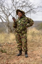 Ranger of the anti-poacher unit Black Mambas with Funfgerät, Balule Game Reserve, Limpopo Province,