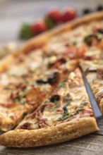 Pizza on an old wooden table